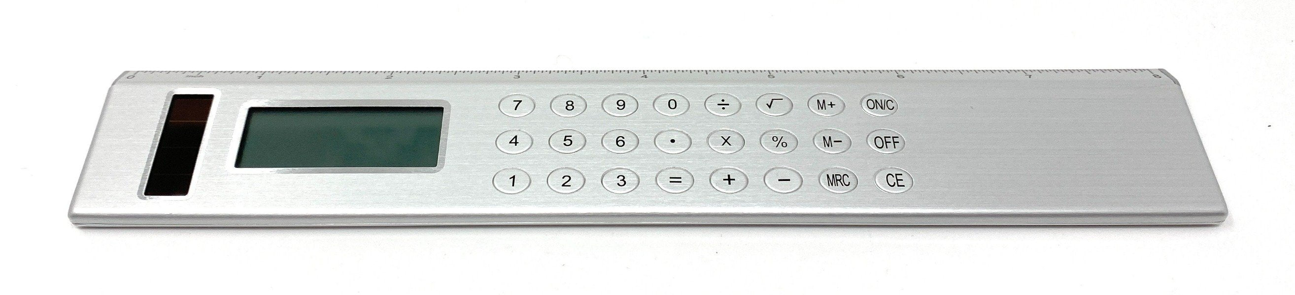 Silver Solar Powered Calculator on an  8-inch Ruler