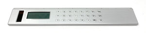 Silver Solar Powered Calculator on an  8-inch Ruler