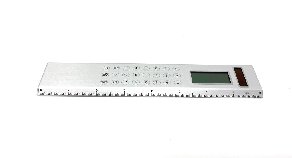 Silver Solar Powered Calculator on an  8-inch Ruler